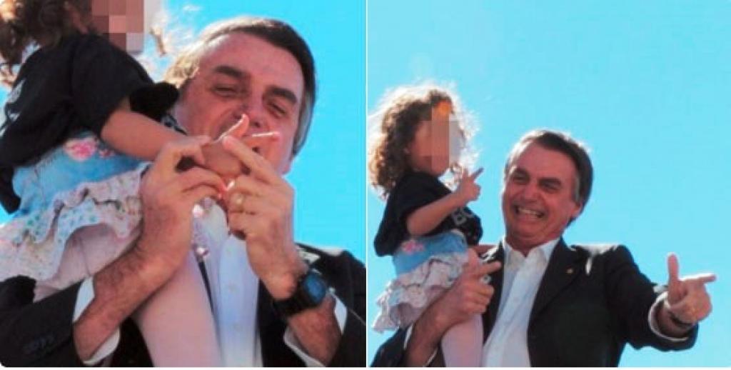 Na foto, candidato ensina menina a fazer sinal de uma arma com a mão
